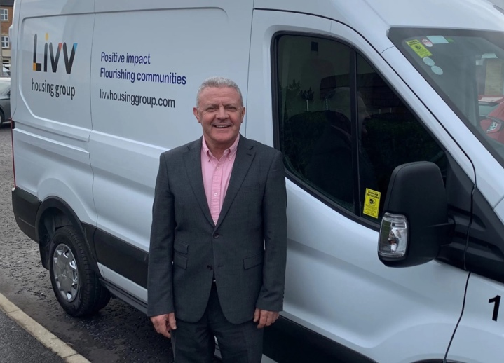 Livv Housing Group's executive director of property, Tony Cahill, standing outside a Livv-branded van