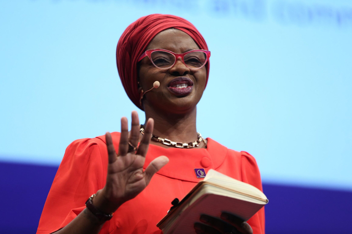 Former CIH president Lara Oyedele speaking on stage